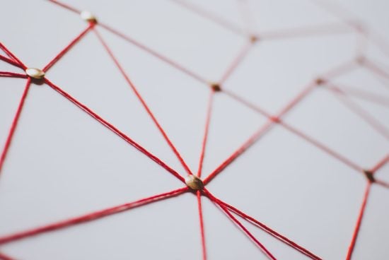 Linking entities. Network, networking, social media, connectivity, internet communication abstract. Web of red thread on white background.